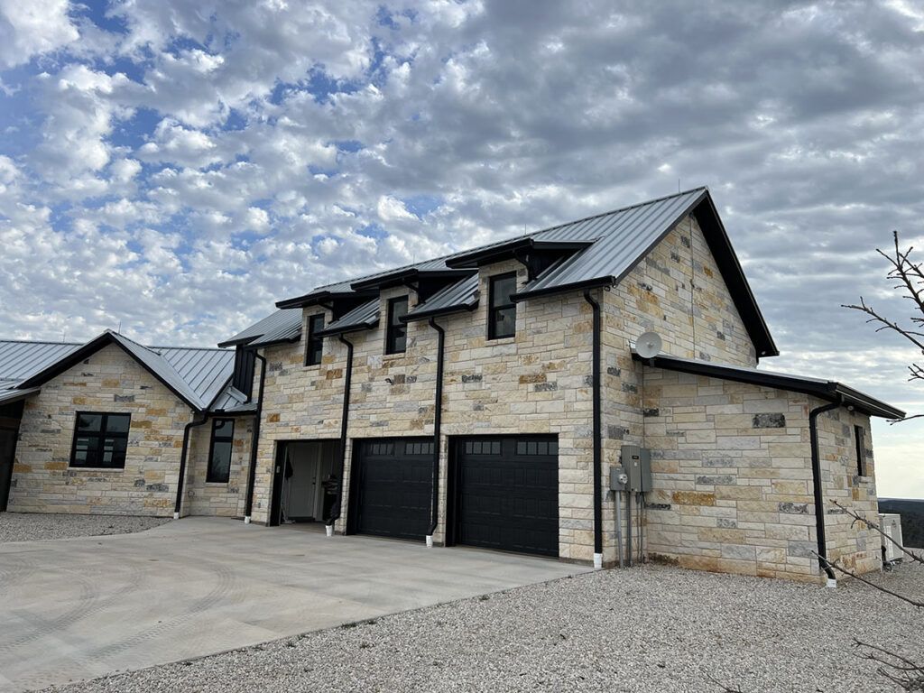 Closer view of 3-car garage and second story above