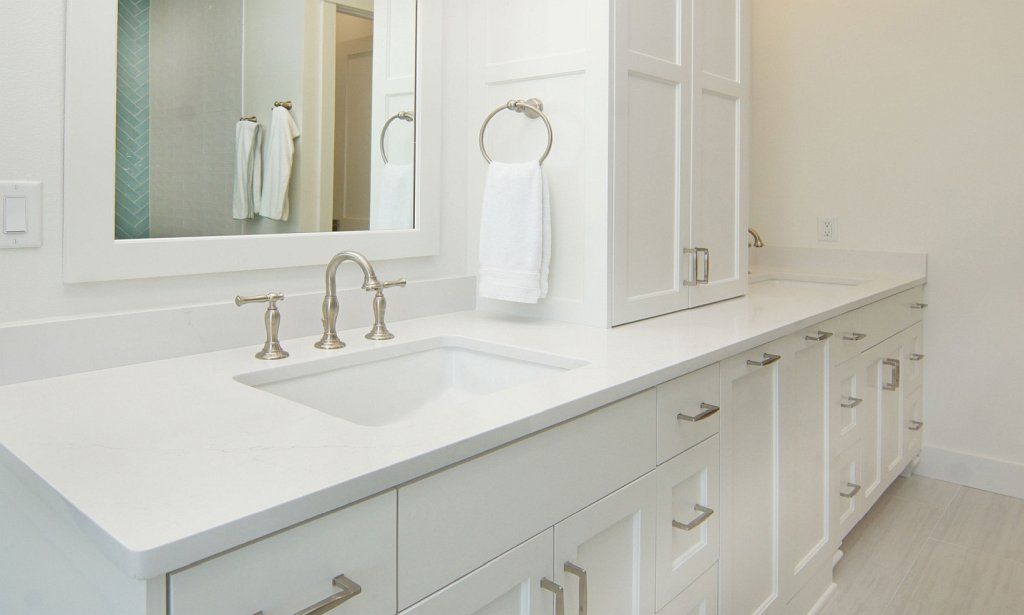 Bathroom with double-sinks and lovely cabinets