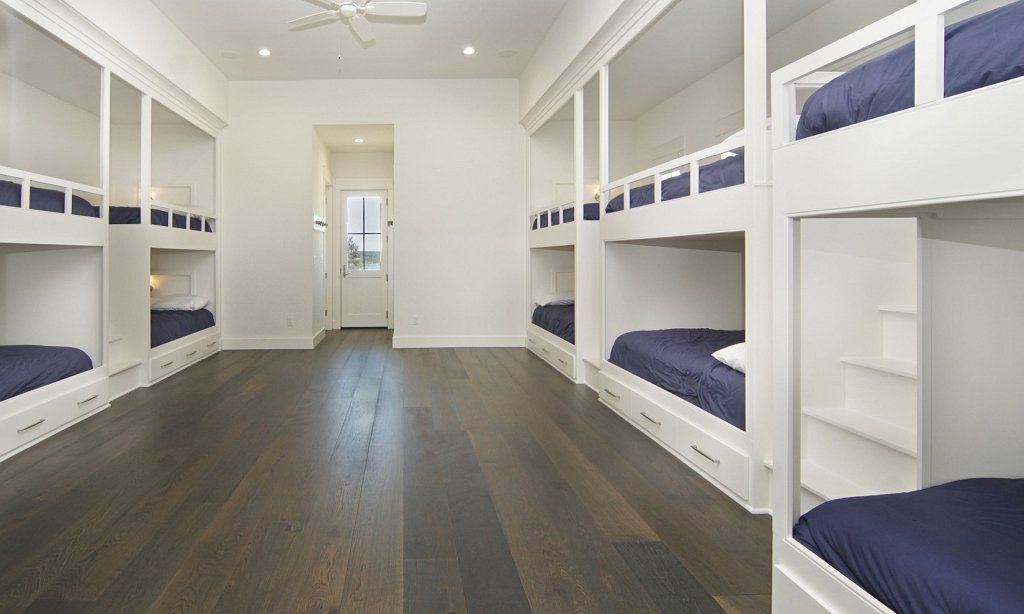 Large guest bedroom with oh, so many bunk beds
