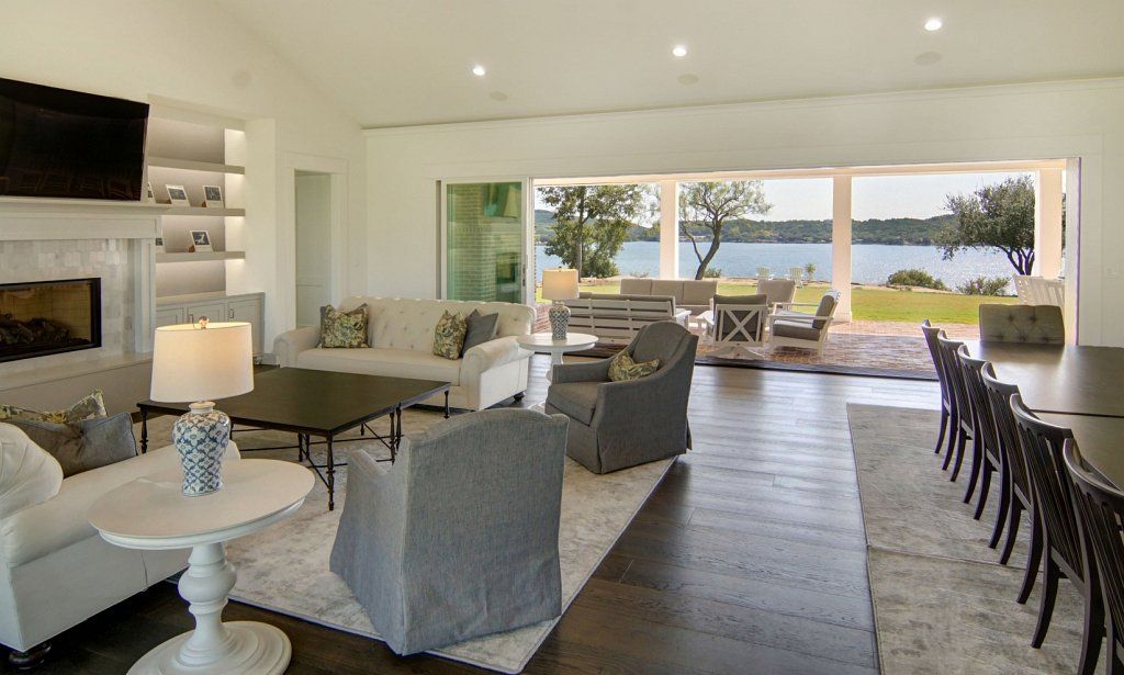 Living room with multiple sliding glass panels that open to the patio